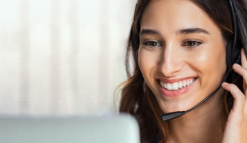 Smiling customer-service woman with a headset